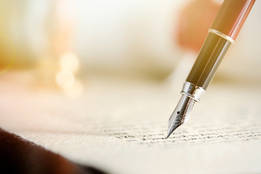 pen writing on paper